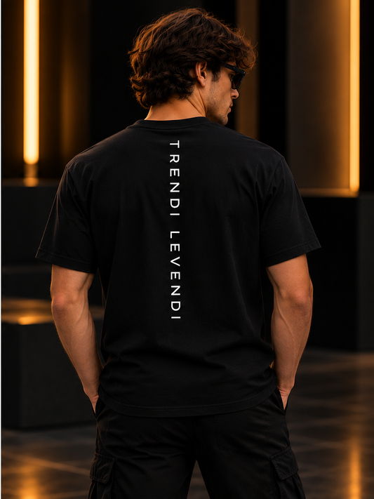 Black heavyweight tee on model, vertical Trendi Levendi back print, premium studio