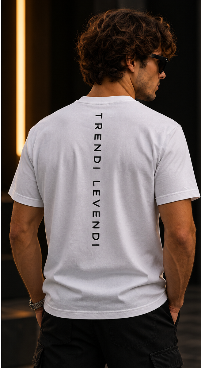 White Trendi Levendi Heavyweight Tee premium studio model back view with vertical brand lettering